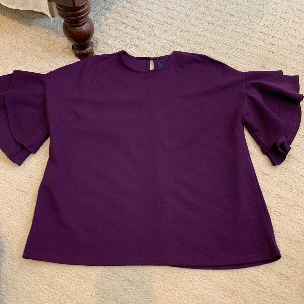 purple ruffle shirt